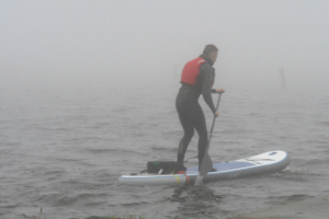 On a lake with a paddleboard based, hubless onboard motot prototype research and development.