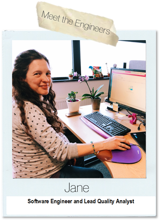 Jane, sitting at her desk 